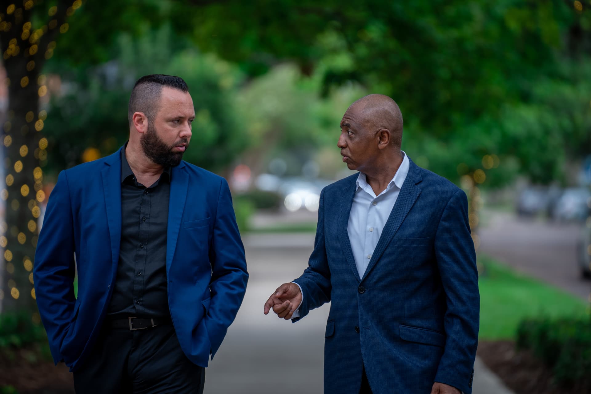 Austin Arthur walking and talking with a community leader in West Orange County, Florida
